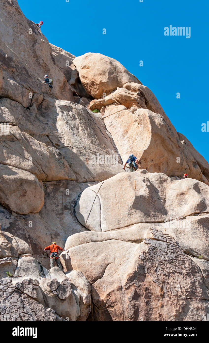 California, Joshua Tree National Park, Hidden Valley Trail, rock climbers Stock Photo