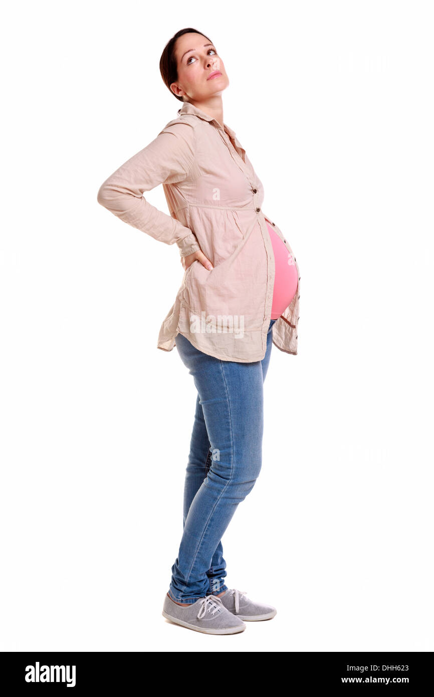 A pregnant woman with backache, isolated on a white background. Stock Photo
