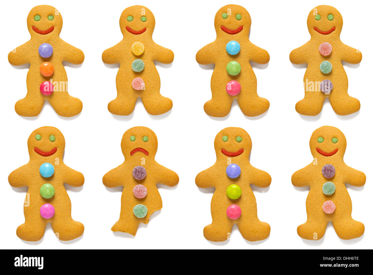 Smiling gingerbread men with one exception, isolated on a white background. Stock Photo