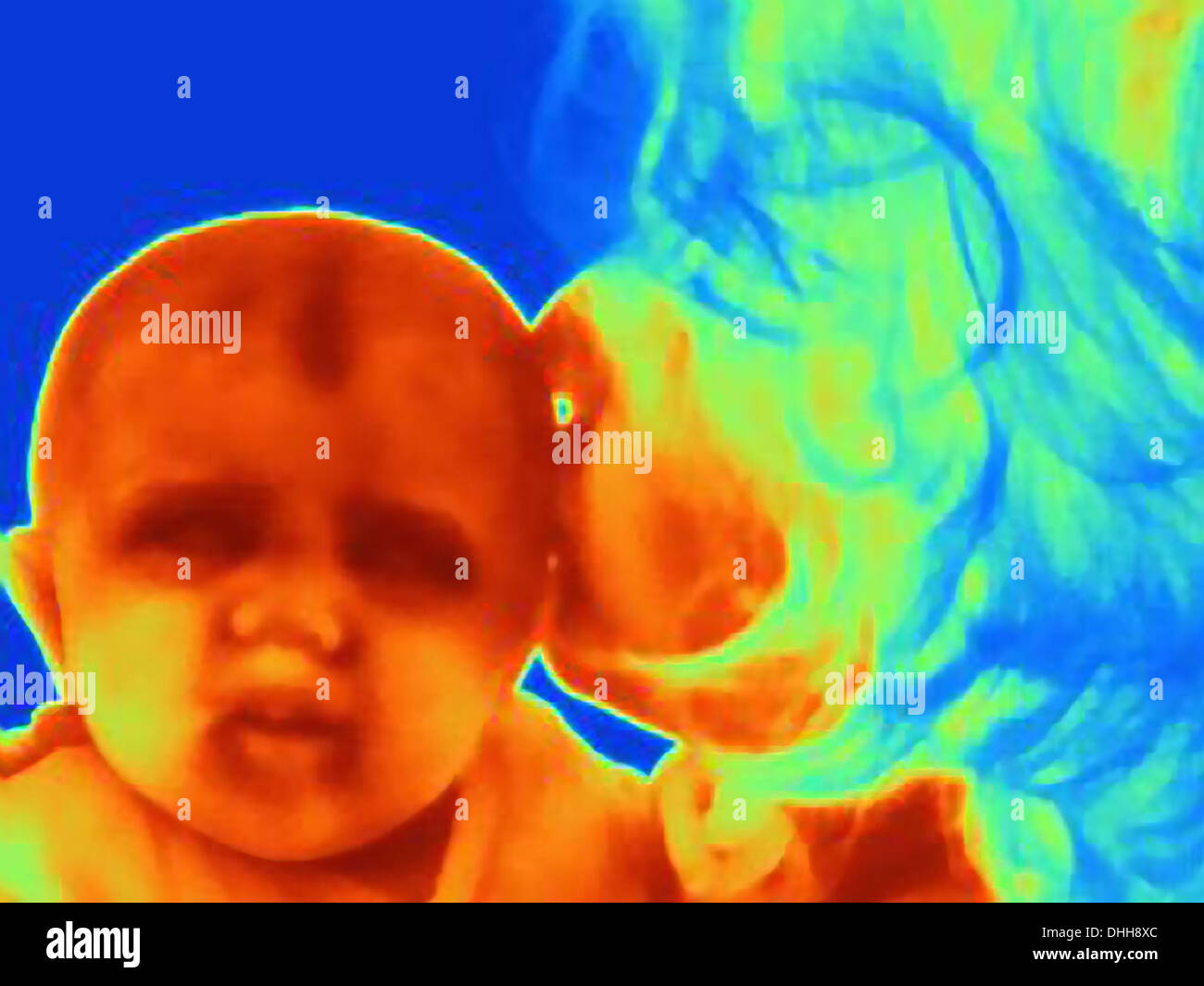 Thermal image of three month old baby and mother Stock Photo