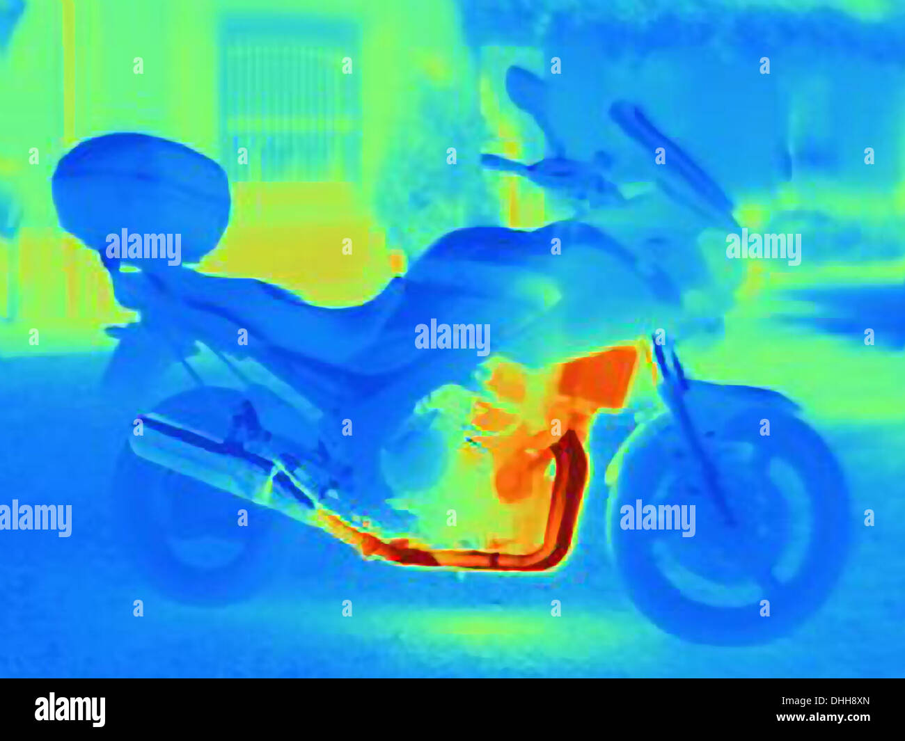 Thermal photograph of a motorcycle showing the heat of the engine, radiator and exhaust pipe Stock Photo