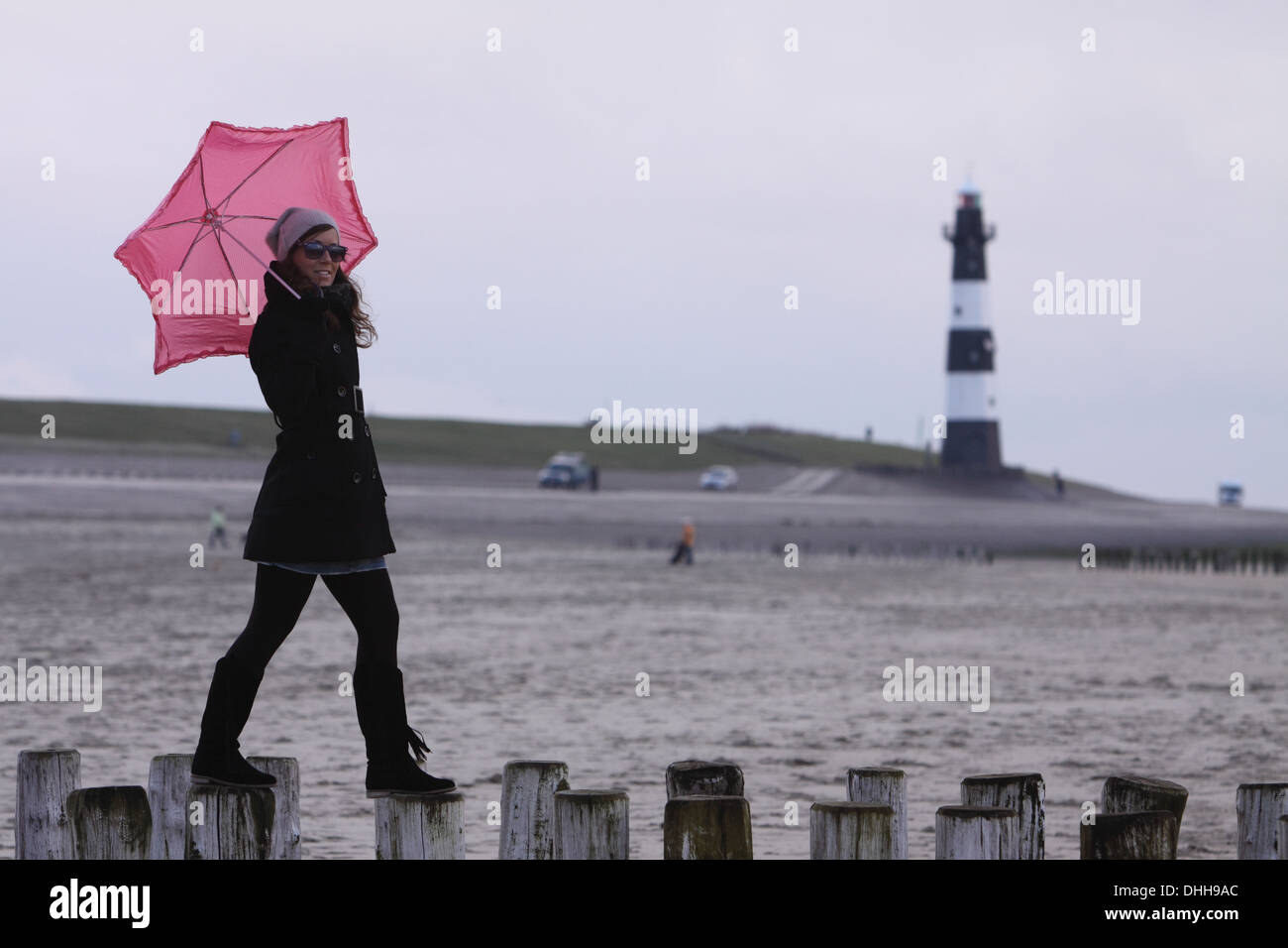 young woman with pink umbrella Stock Photo