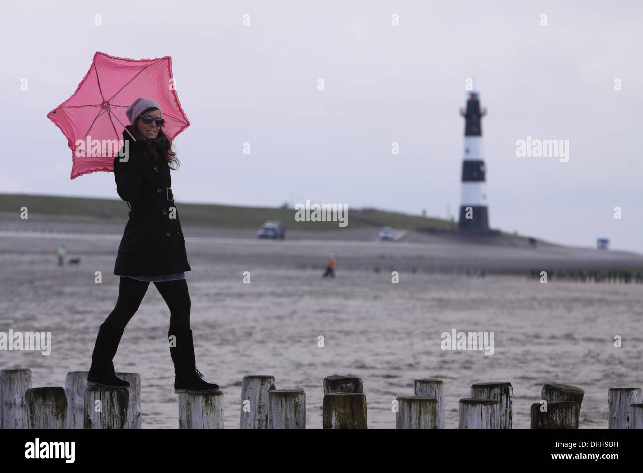 young woman with pink umbrella Stock Photo