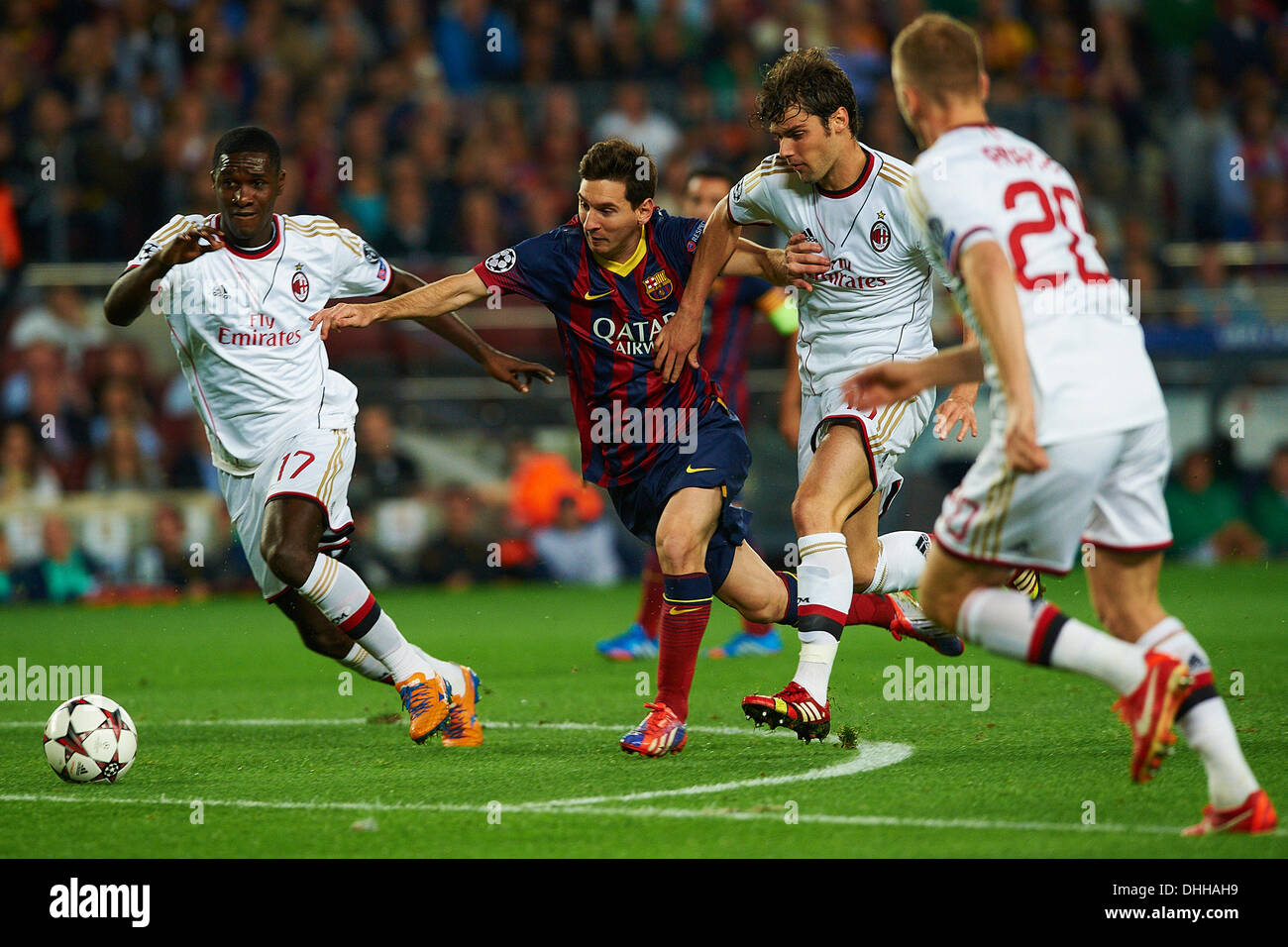 from left Cristian Zapata (AC Milan), Lionel Messi (FC Barcelona), Andrea Poli (AC Milan), during the Champions League soccer match between FC Barcelona and AC Milan, at the Camp Nou stadium in Barcelona, Spain, wednesday, november 6, 2013. Foto: S.Lau Stock Photo