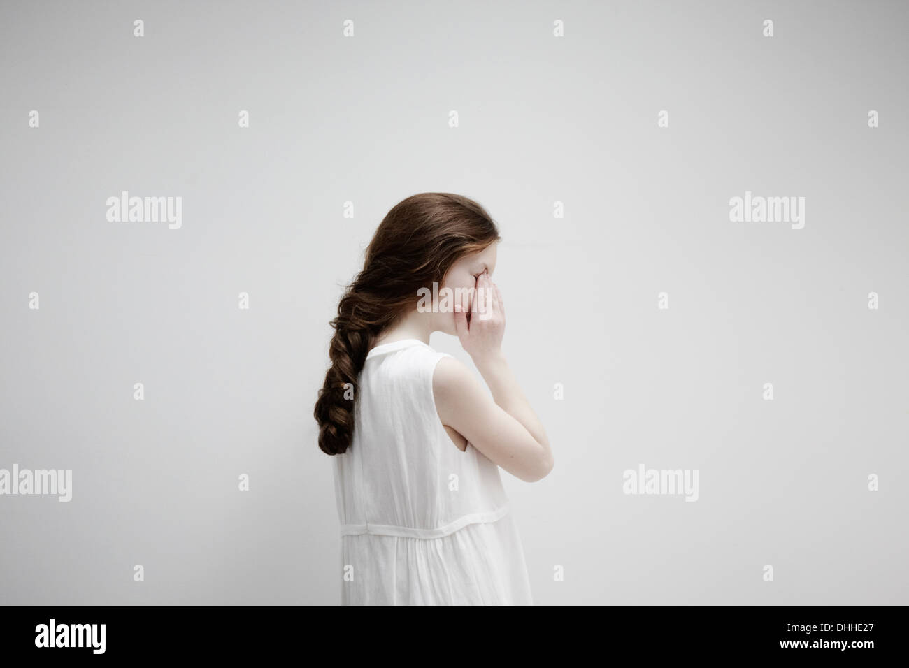 Girl posing sideways for camera Stock Photo - Alamy