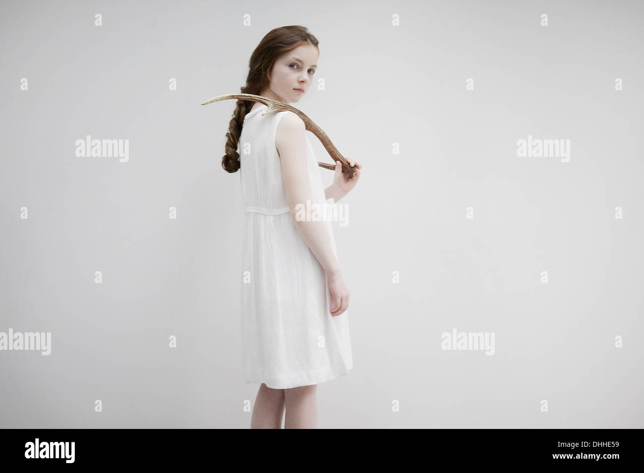 Girl posing sideways with antlers Stock Photo