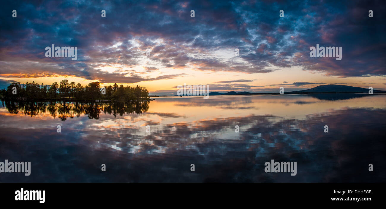 Reflection on lake at dawn, Arjeplog, Lapland, Sweden Stock Photo