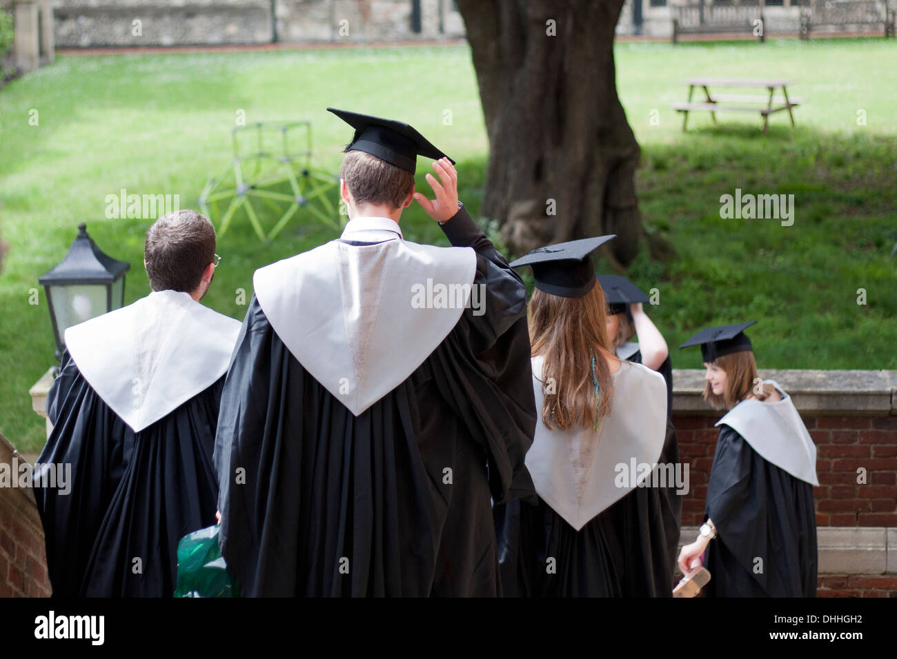 University graduates from University of Kent at Canterbury leaving the robing room in the grounds of Canterbury Cathedral. Stock Photo