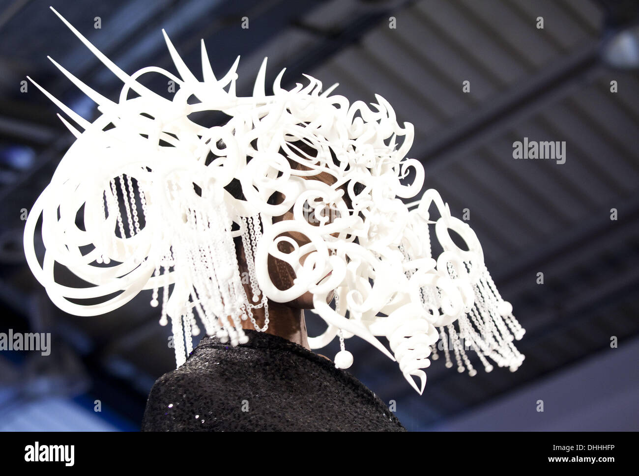 London, UK. 9th Nov, 2013. Quixotic Divinity Headdress by Joshua Harker at the 3D Fashion Show London.As the 3D printing has exploded into the public consciousness this year, second annual 3D Print Show in London has attracted many more exhibitors from all over the world, developers presenting innovations, 3D fashion and stunning artworks, Islington Business Center, London, UK. © Veronika Lukasova/ZUMAPRESS.com/Alamy Live News Stock Photo