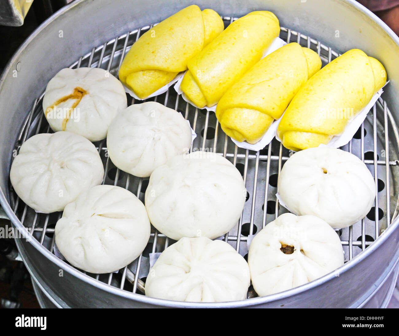 Chinese dumplings being steamed on the traditional pan Stock Photo Alamy