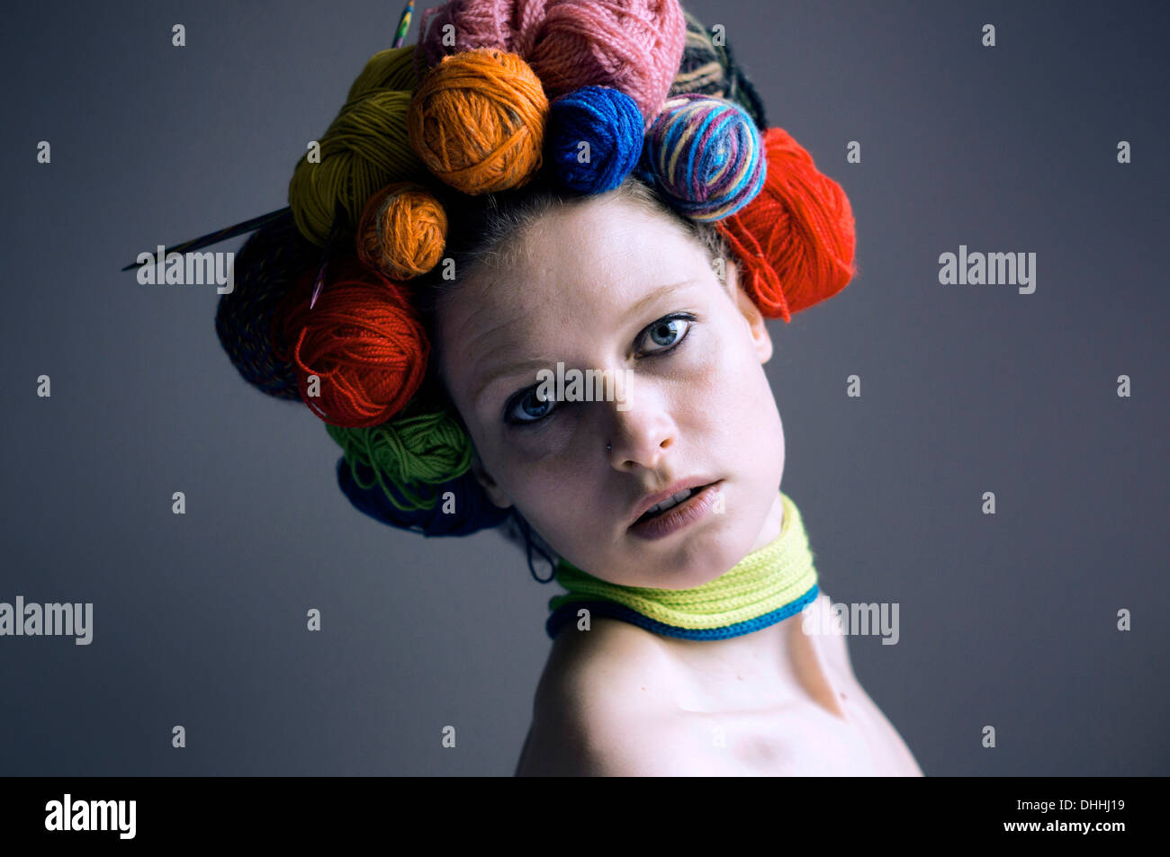 Woollen head, woman with balls of wool or yarn on her head as a headdress Stock Photo Alamy