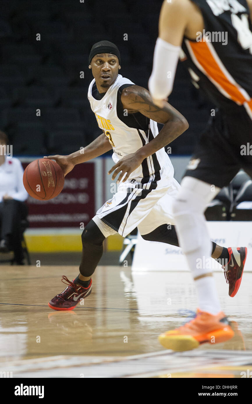 Back to back league champions, the London Lightning improved their record to 1-2 defeating the Ottawa Skyhawks on November 9, 2013 in London Ontario, Canada in a National Basketball League of Canada game.  Tim Ellis of the Lightning looks for a pass as he breaks up court. Stock Photo
