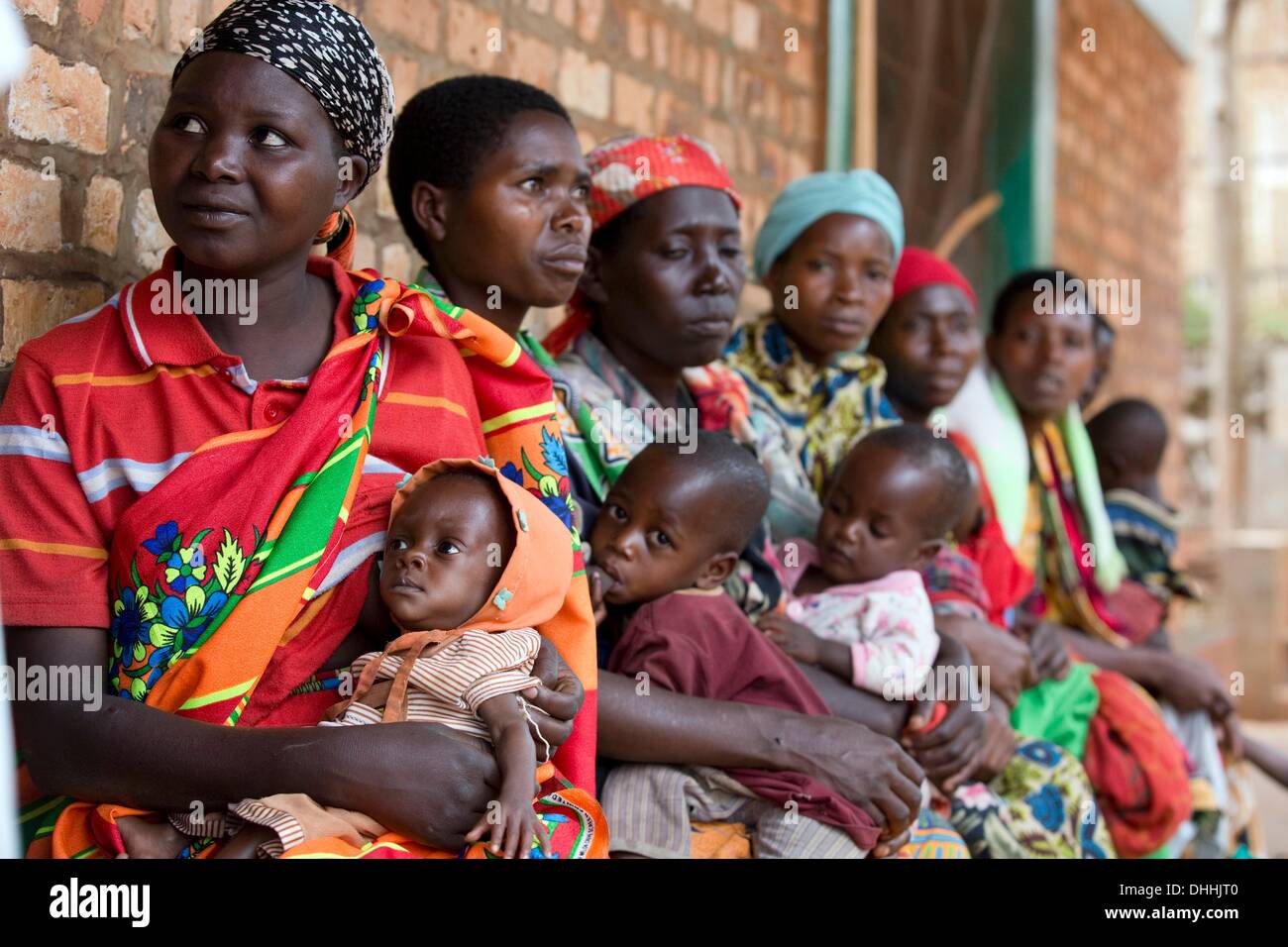Women wait with their babies for an examination at a health station in Rukogo near Kayanza in the north of Burundi, 23 September 2013. Photo: Tom Schulze Stock Photo