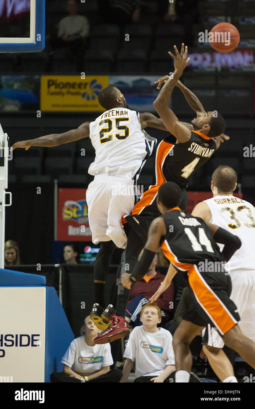 Back to back league champions, the London Lightning improved their record to 1-2 defeating the Ottawa Skyhawks on November 9, 2013 in London Ontario, Canada in a National Basketball League of Canada game.  Gabe Freeman (25) blocks the shot of Fred Sturdivant. London won the game 98-97 Stock Photo