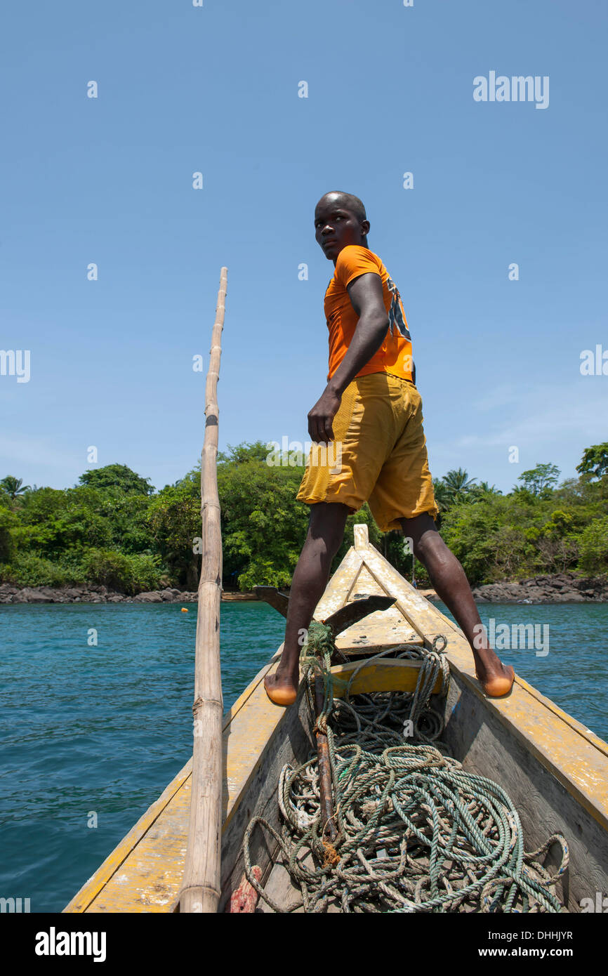 Boatsman looking for a suitable place to dock, Banana Islands, Western Area, Sierra Leone Stock Photo