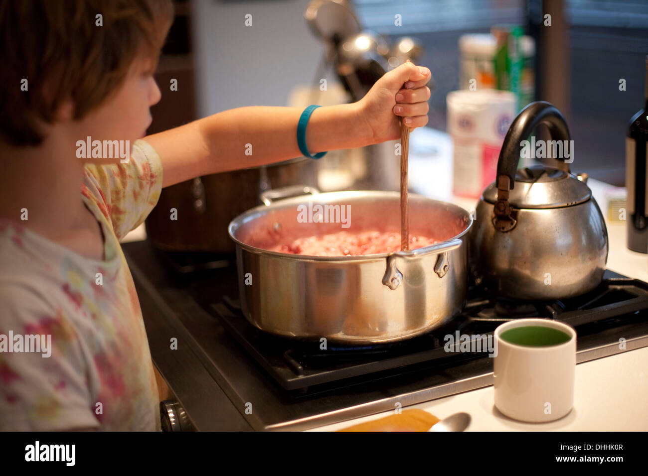 cooking sweet sponge cake at home - measuring temperature of ingredients in  glass bowl on water bath by infrared thermometer on stove at home kitchen  Stock Photo - Alamy