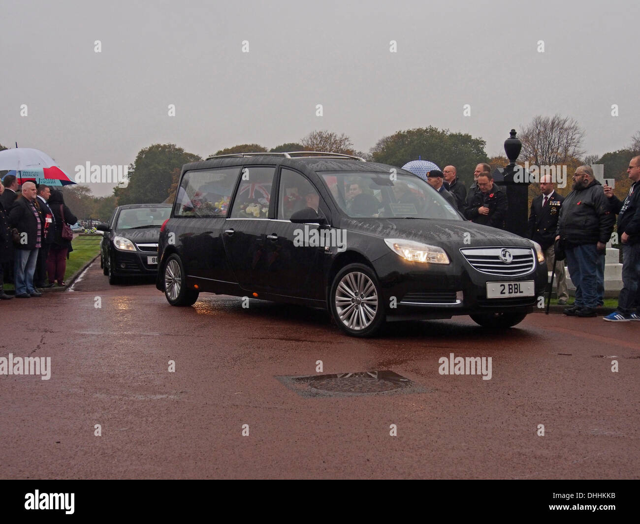 LYTHAM ST ANNES, UK 11TH November 2013. Hearse carrying coffin of WWII 99 year old WWII  war veteran Harold Jellicoe Percival arrives at Lytham Park Cemetery. Credit:  Sue Burton/Alamy Live News Stock Photo