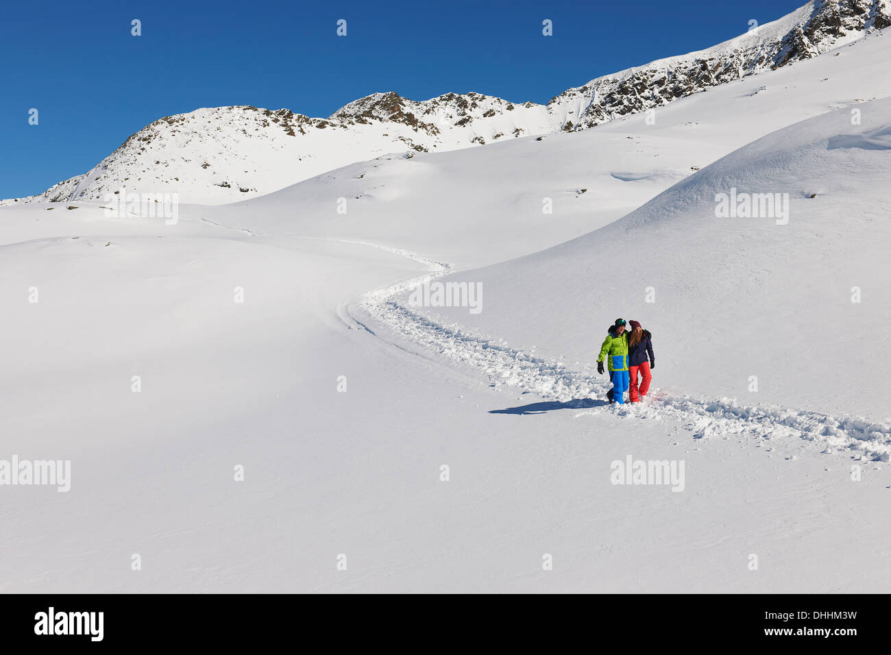 Couple walking in snow, Kuhtai, Austria Stock Photo