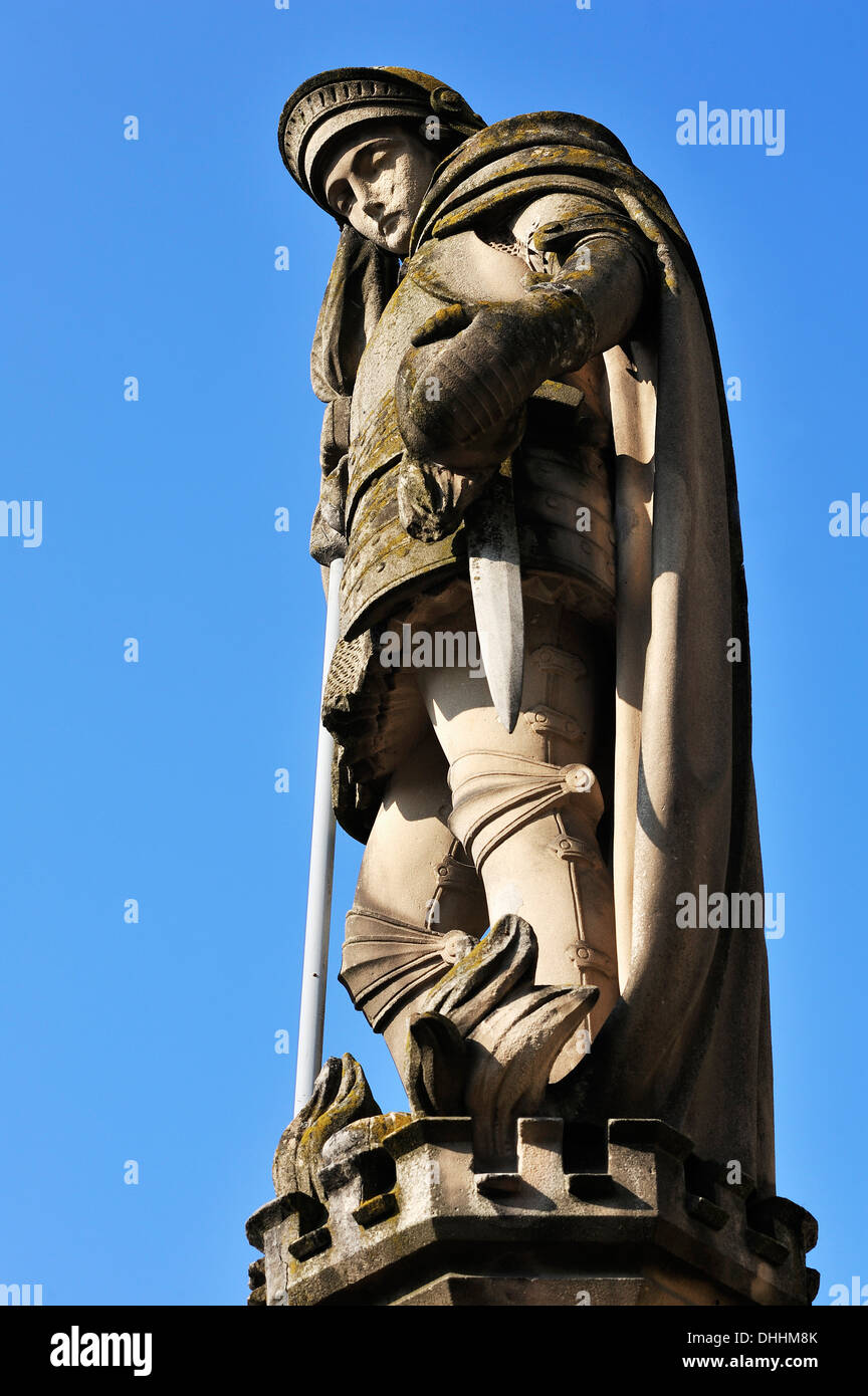 Sandstone statue of St. Florian against a blue sky, Hassfurt, Lower Franconia, Bavaria, Germany Stock Photo