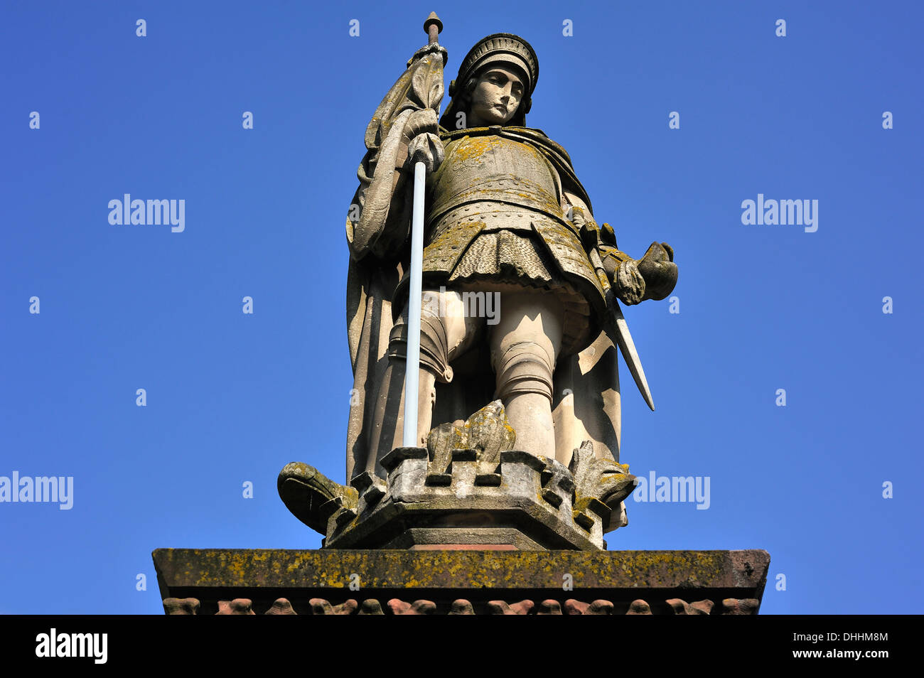 Sandstone statue of St. Florian against a blue sky, Hassfurt, Lower Franconia, Bavaria, Germany Stock Photo
