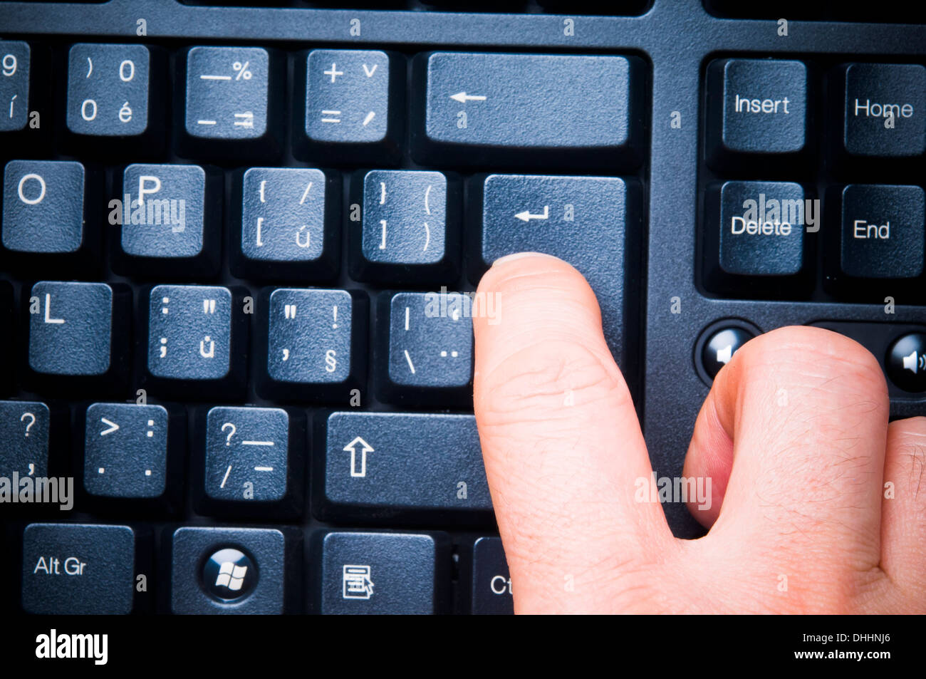 pressing a keyboard enter key Stock Photo