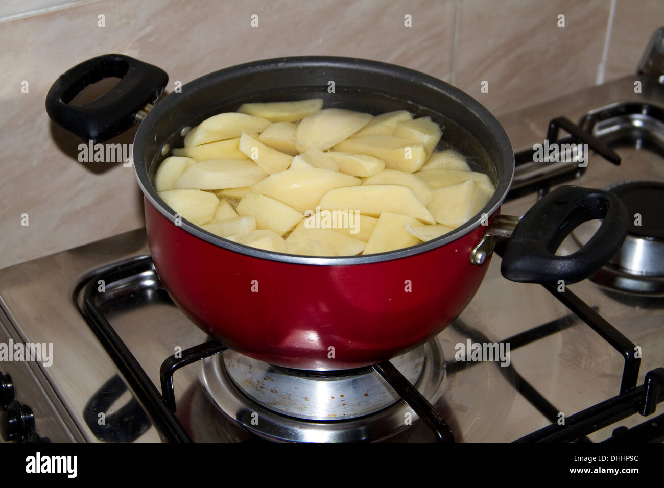 Cooking Potatoes in Cooking Pot Stock Photo