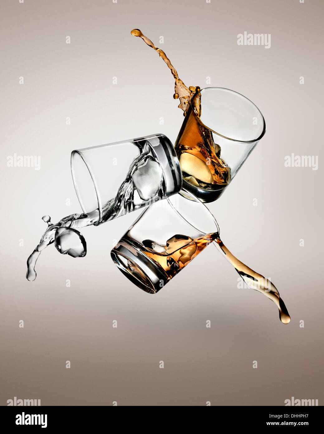 Three glasses with spirits spilling out Stock Photo Alamy
