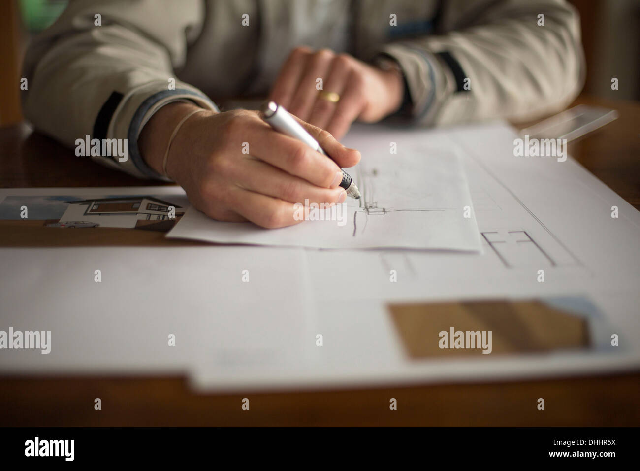 Mid-section of man doing technical drawing Stock Photo