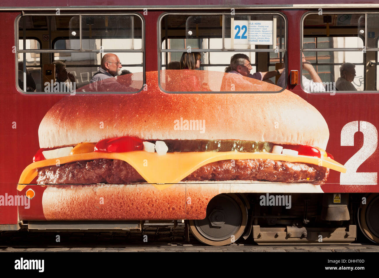 Tramcar, advertising a cheeseburger, Prag, Czech Republic Stock Photo