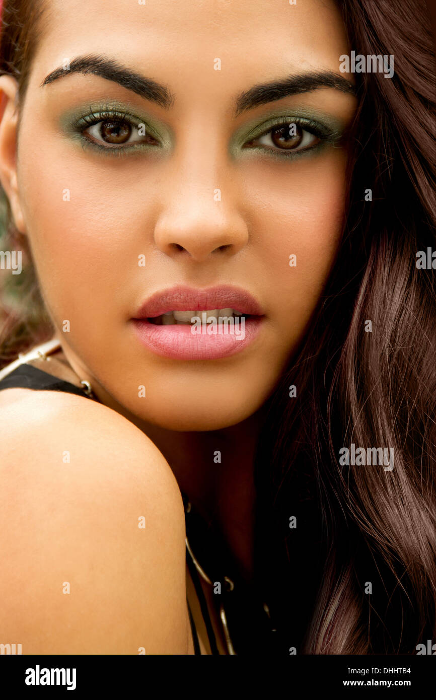Portrait of young woman, wearing eye shadow, looking at camera Stock Photo