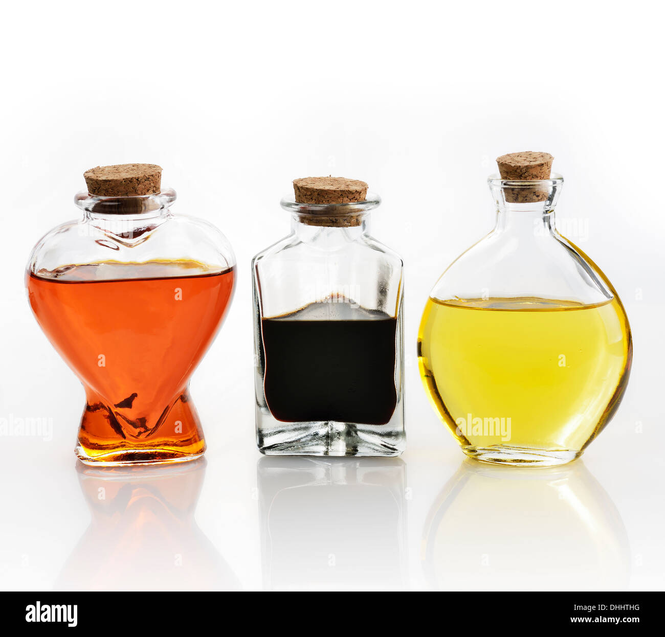 Glass Bottles Of Oil And Vinegar On White Background Stock Photo