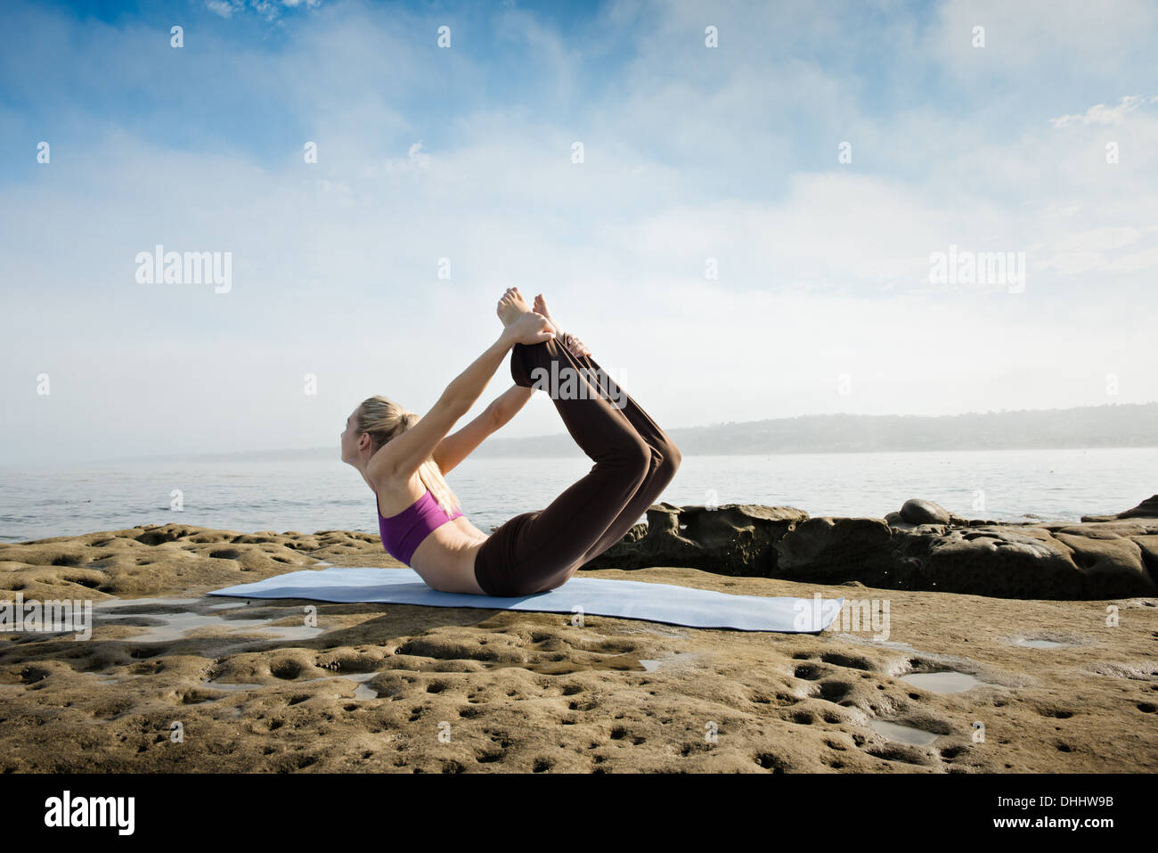 Woman doing yoga hi-res stock photography and images - Alamy