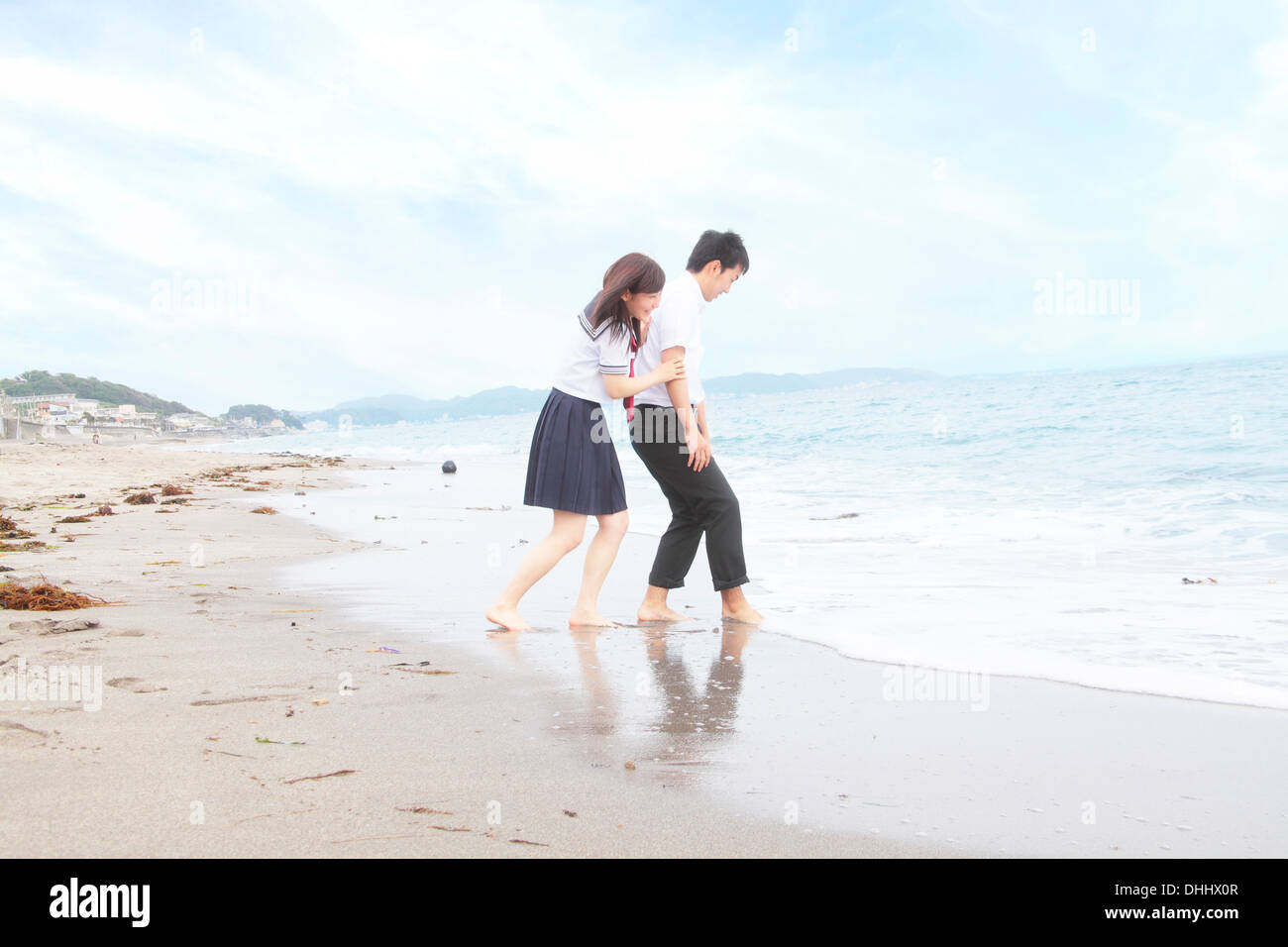 Young couple fooling around on beach Stock Photo