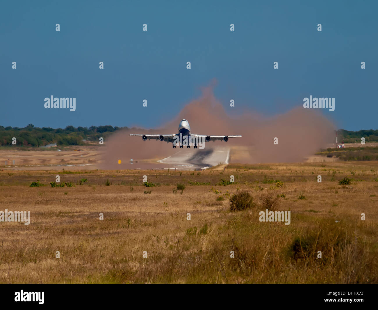 airplane takeoff and make a lot of dust Stock Photo