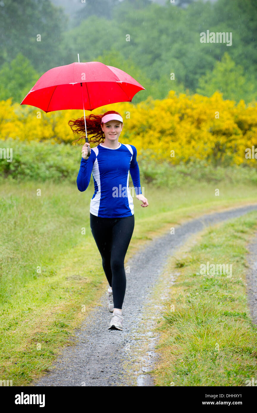 Running girl tracksuit hi-res stock photography and images - Alamy
