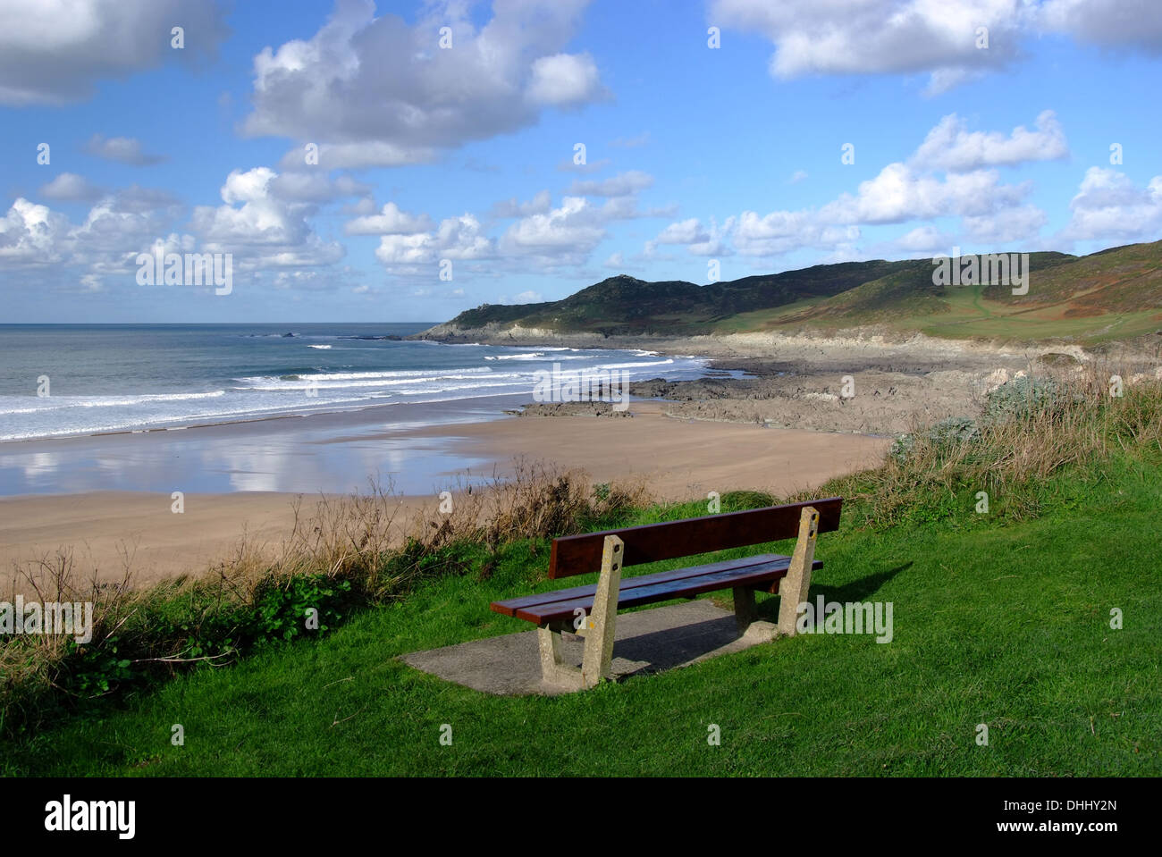 open view of north end of beach with bench in