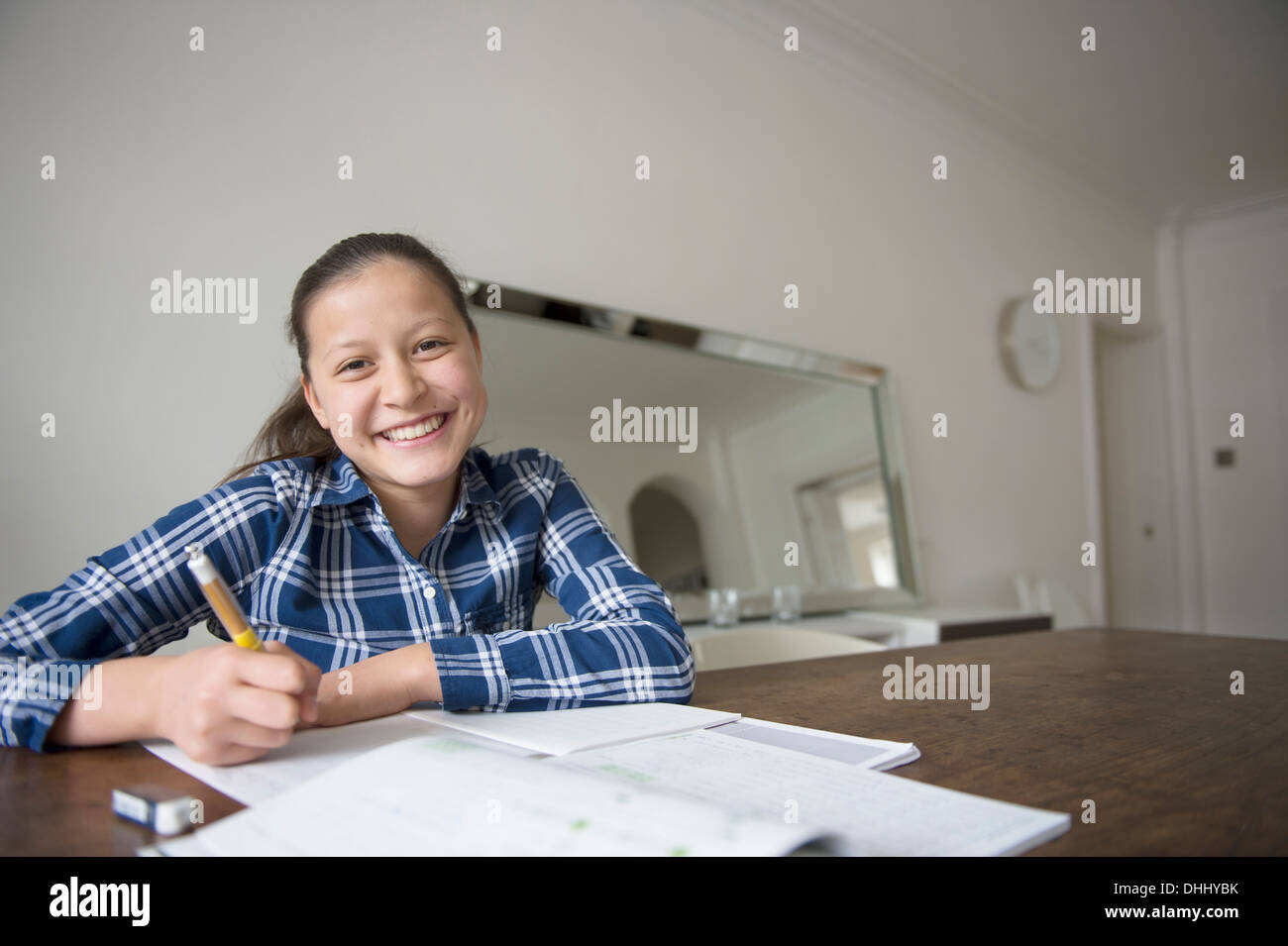 Teenage girl doing homework Stock Photo