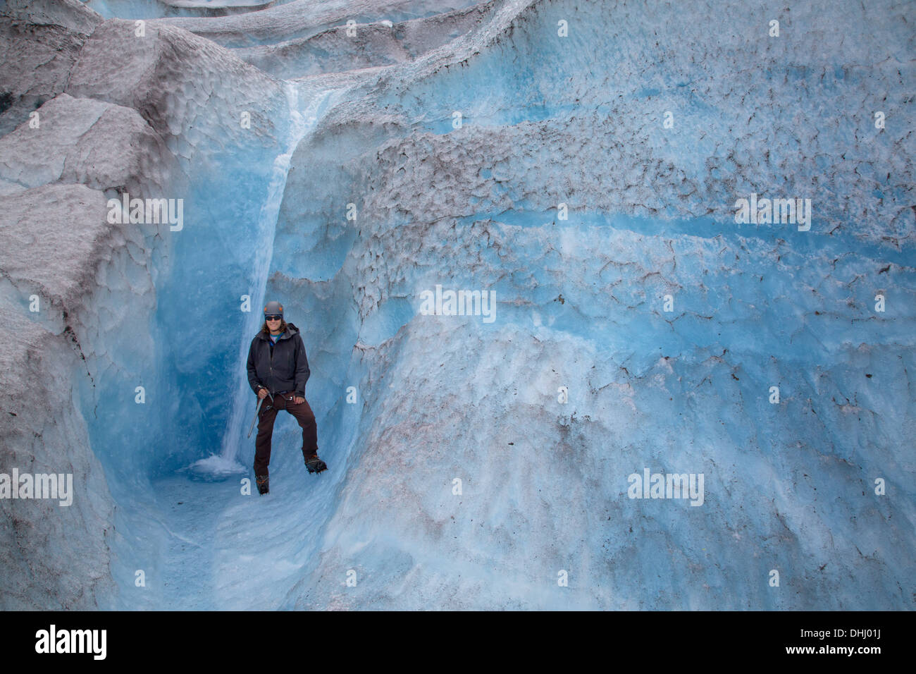 Man standing on Mendenhall Glacier, Alaska, USA Stock Photo