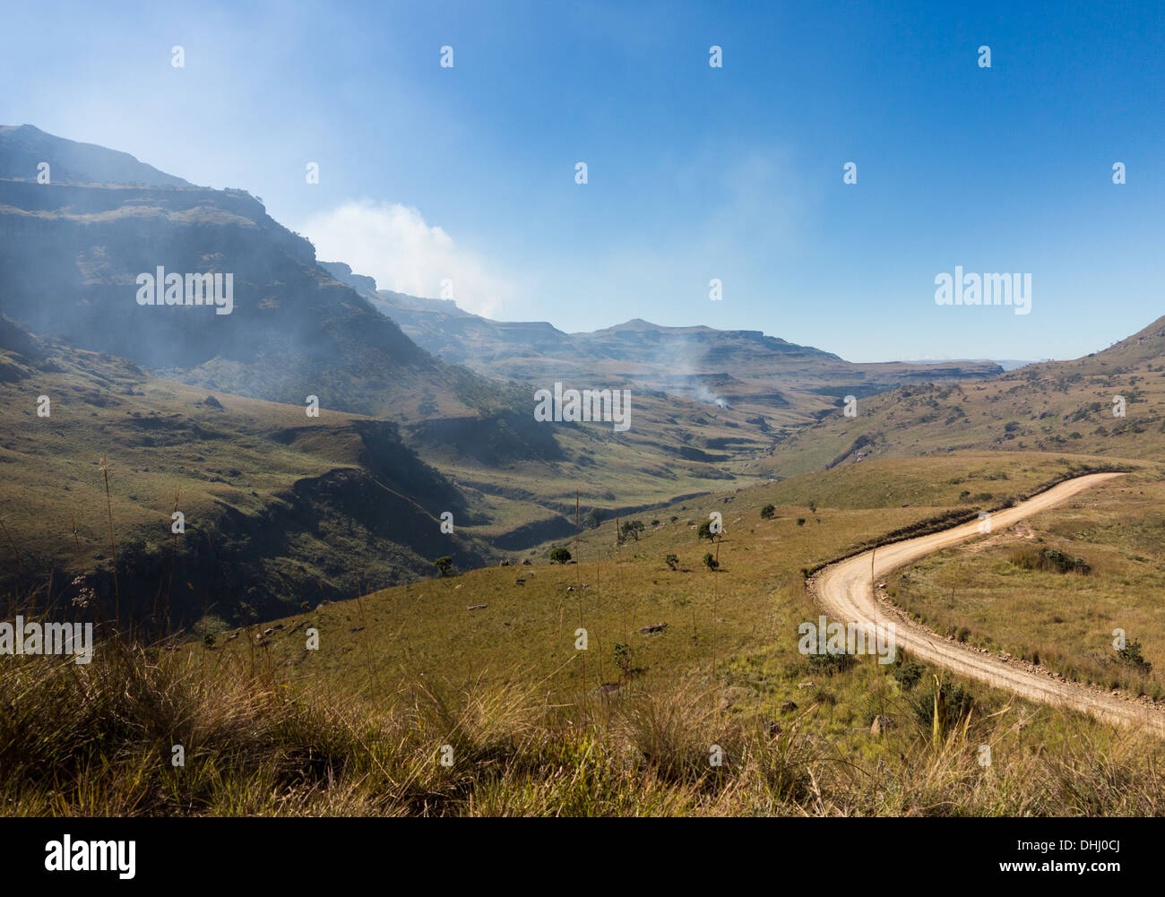 Valley and winding road over the Drakensberg mountains from South Africa to Lesotho over Sani Pass in KwaZulu-Natal Stock Photo