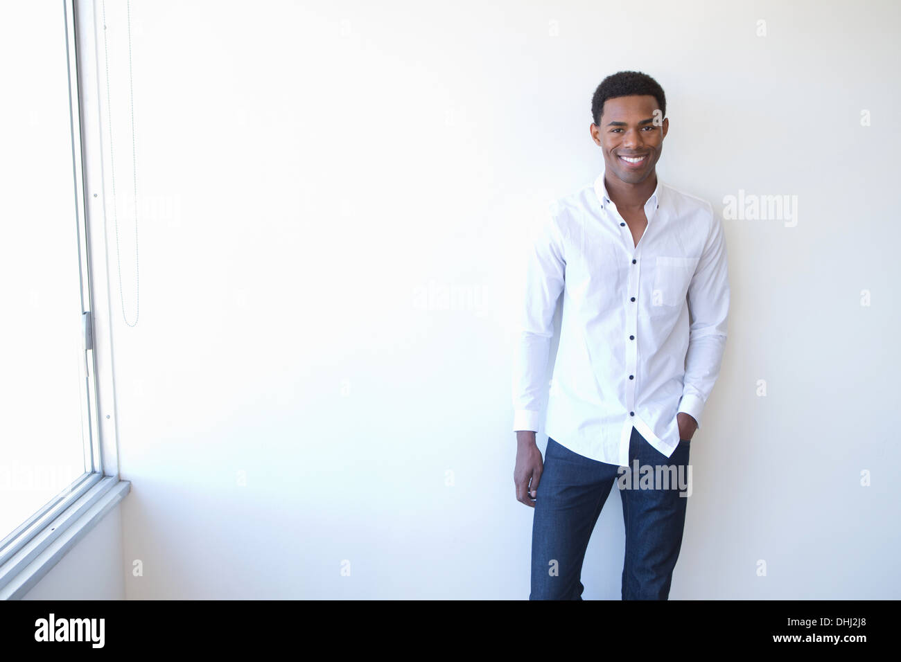 Young man wearing white shirt hi-res stock photography and images - Alamy