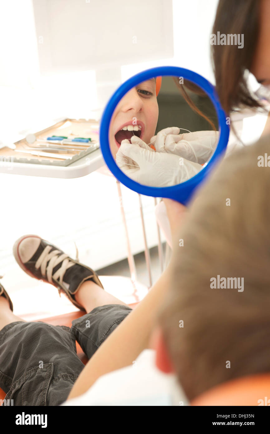 Dental patient flossing teeth Stock Photo