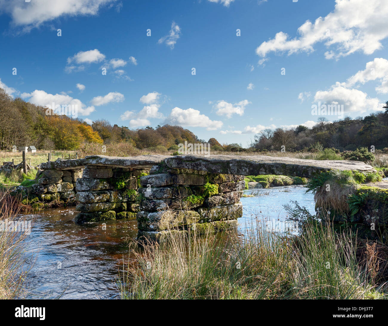 A granite clapper bridge across the river Dart at Postbridge on ...