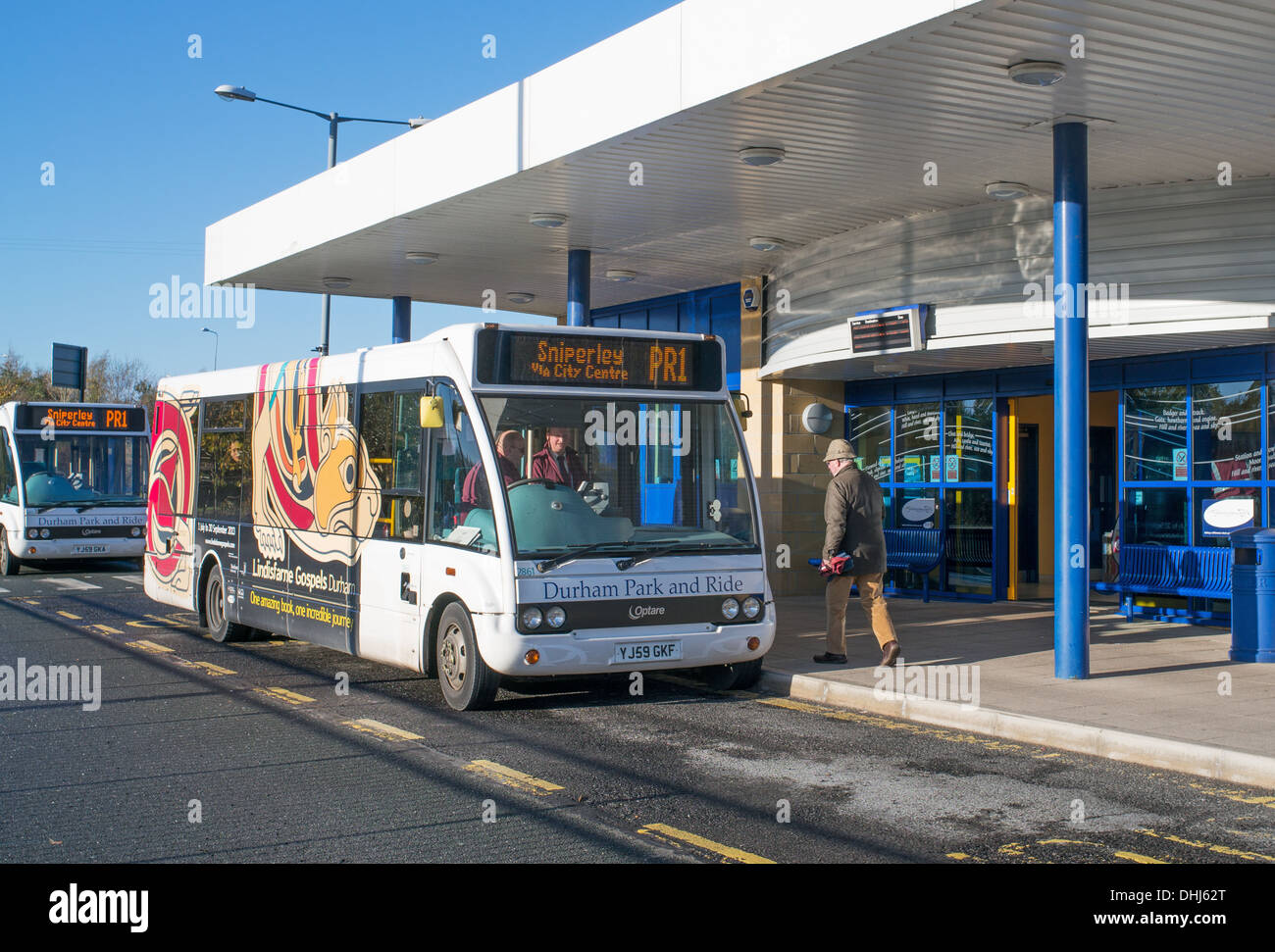 Passenger boarding a Durham bound park and ride Optare bus at Belmont,  Co. Durham, England, UK Stock Photo