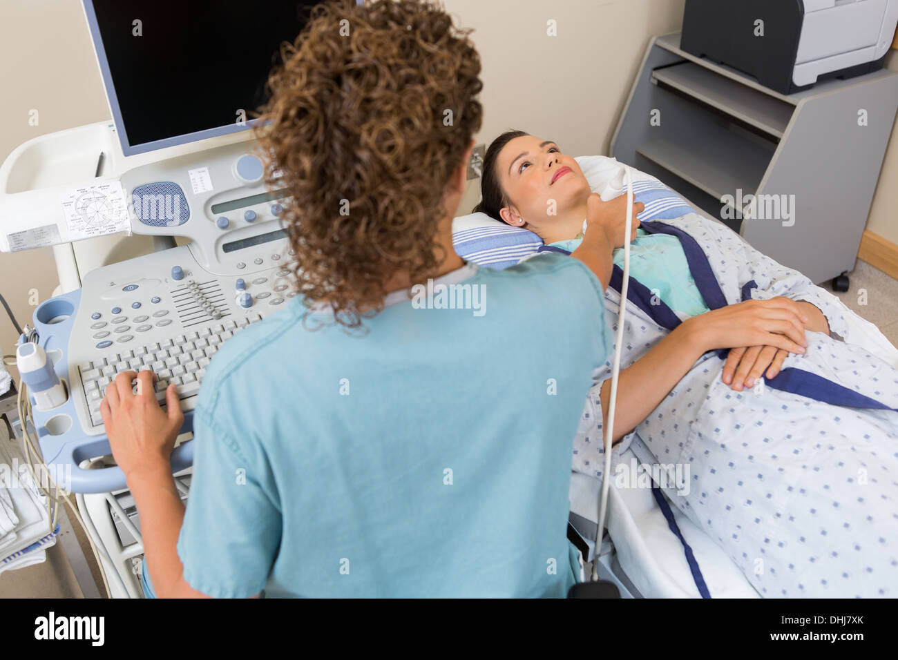Nurse Performing Ultrasound Scan On Patients Neck Stock Photo Alamy