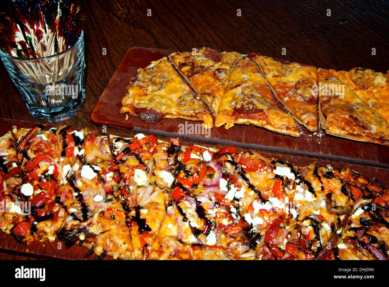 Flatbread vegetarian & pepperoni cheese pizzas pub fast food sharing platters Stock Photo