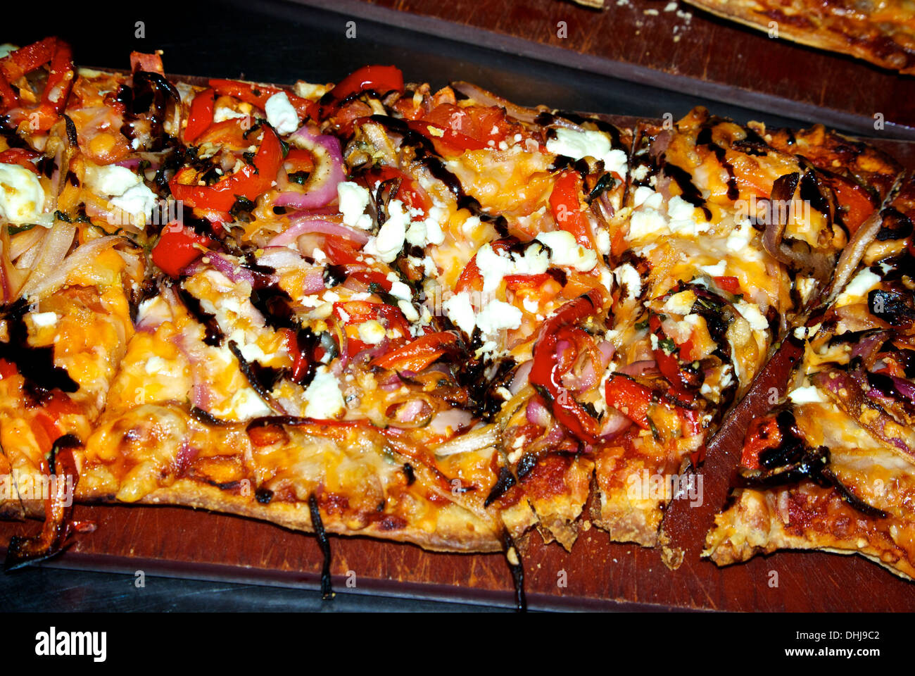Grilled vegetable flatbread pizza sweet red pepper slices feta cheddar