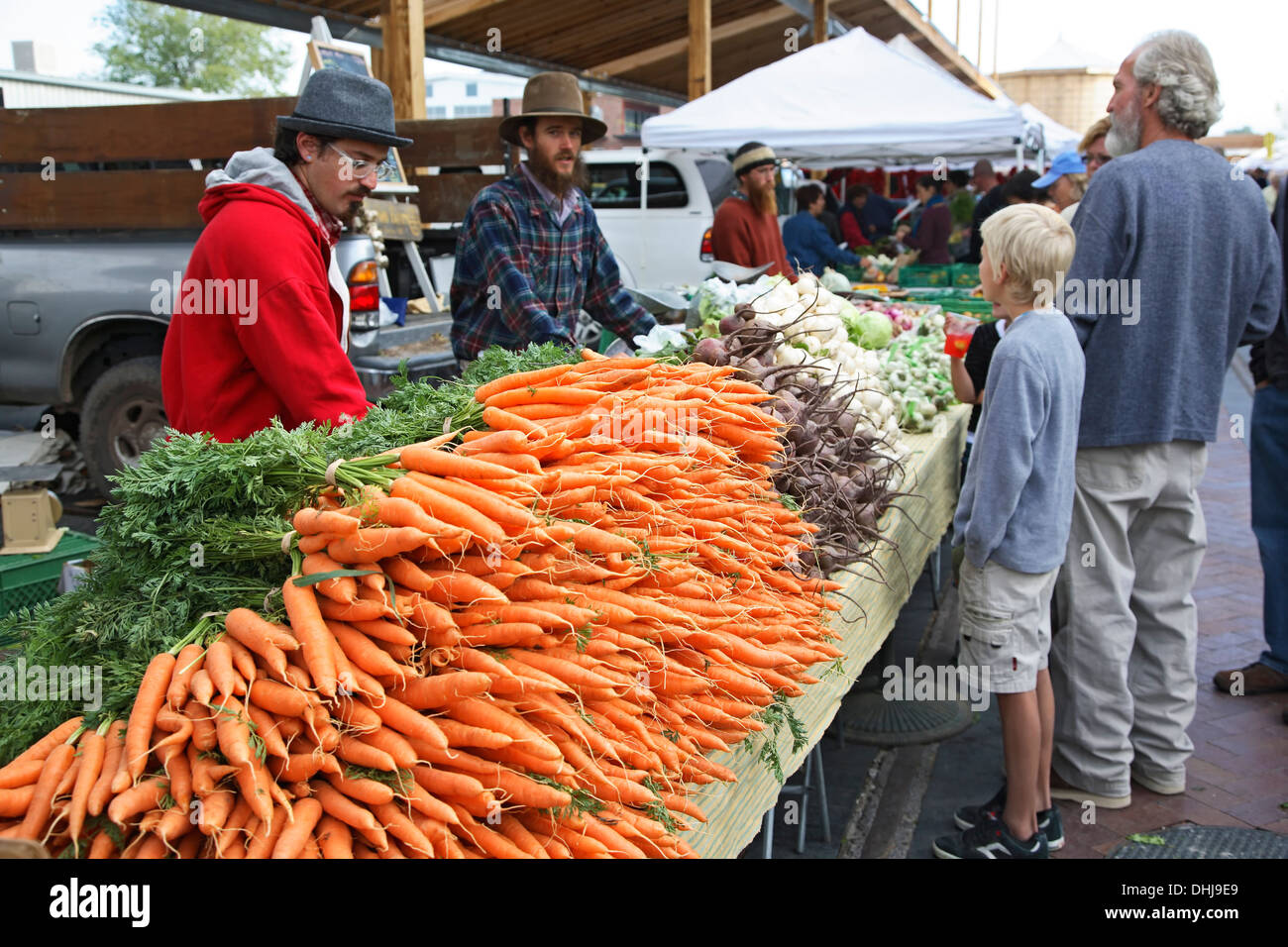 Shoppers and vendors at produce stall, Farmers' Market, Railyard