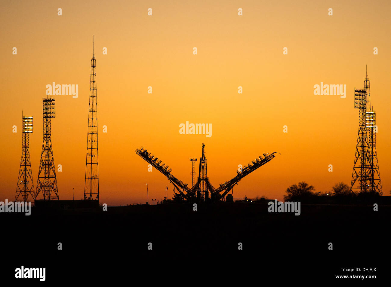 The Soyuz Launch Pad is silhouetted by the sunrise ready for the Soyuz TMA-11M rocket being moved into position by train November 5, 2013 at the Baikonur Cosmodrome, Kazakhstan. Launch of the Soyuz rocket is scheduled for November 7 and will send Expedition 38 Soyuz Commander Mikhail Tyurin of Roscosmos, Flight Engineer Rick Mastracchio of NASA and Flight Engineer Koichi Wakata of the Japan Aerospace Exploration Agency on a six-month mission aboard the International Space Station. Stock Photo