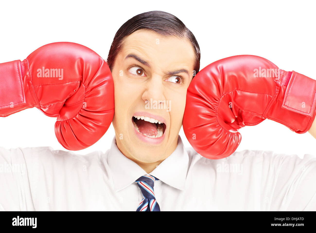 Young man punched by red boxing gloves Stock Photo - Alamy