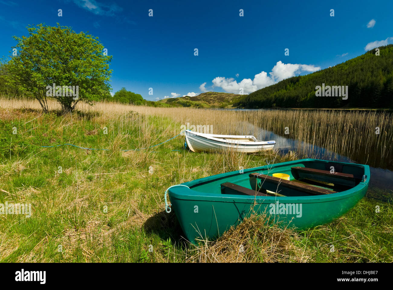 Easdale Seil Island near Oban, Highlands of Scotland UK two rowing boats ashore by a small lake Stock Photo